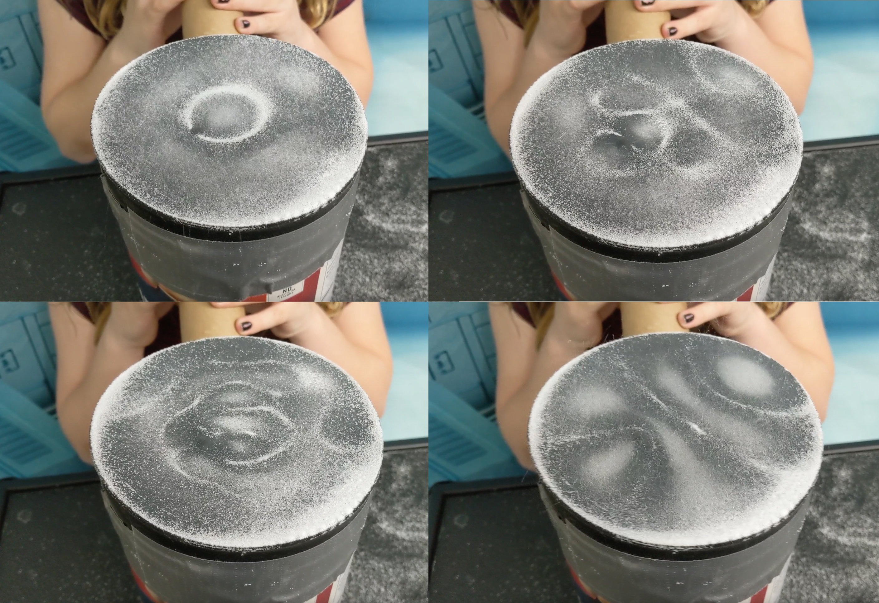 A balloon stretched over a cylinder with salt forming a pattern on top